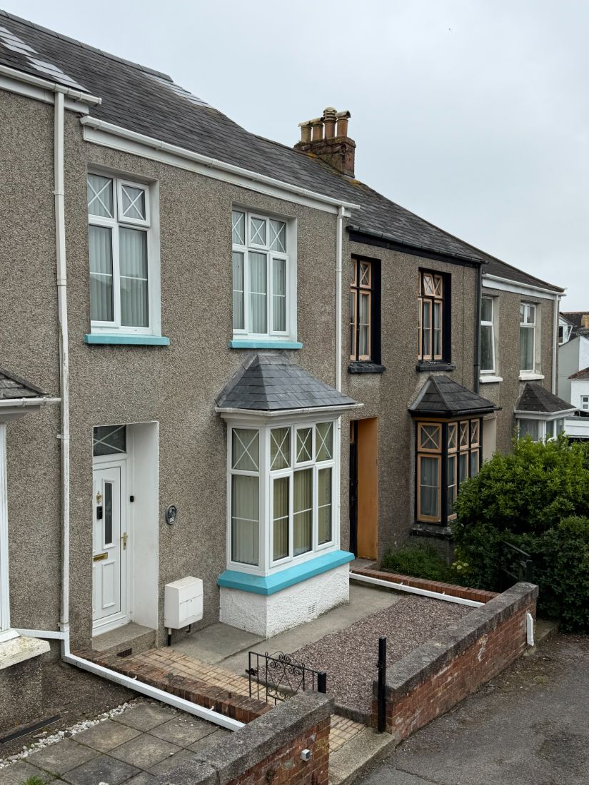 A traditional Cornish property re-roofed in slate, seen from the street